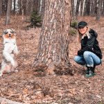 dog pose with tree and woman