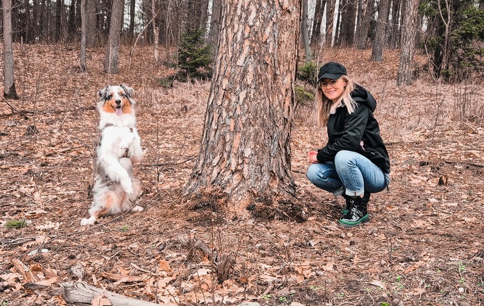 dog pose with tree and woman